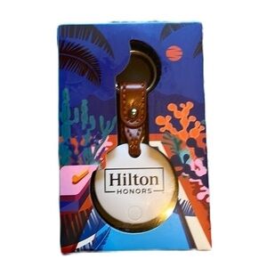 Bluetooth tracker NWT with Hilton logo